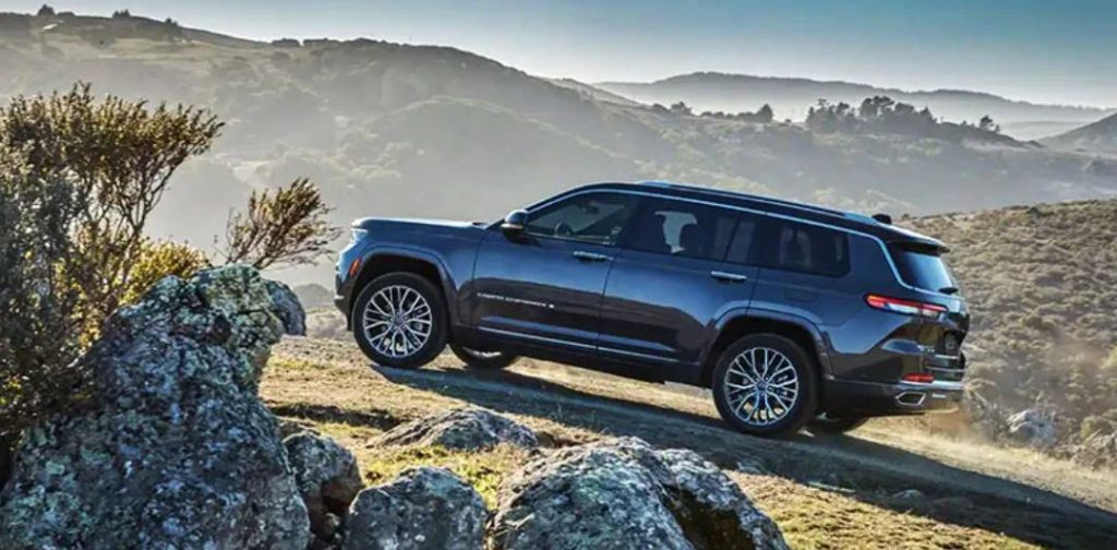 A 2022 Jeep Grand Cherokee driving uphill.