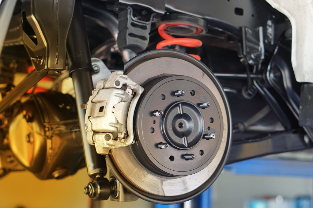 Closeup image of brakes on a car.
